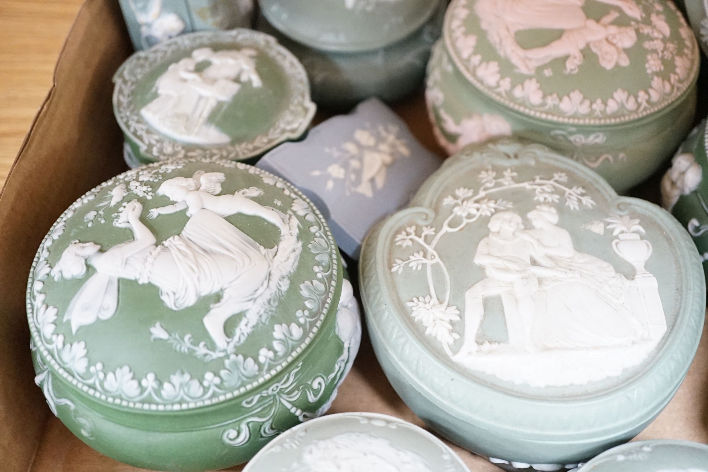 A collection of French bisque boxes and vases